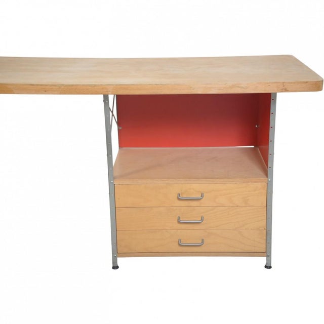 Charles Eames desk with a tabletop of ash and metal frame. The table is from the 1990s and appears with marks and...