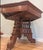 A hexagonal center table in the Eastlake style, tri-part center pedestal with carved floral detail along with elaborate...