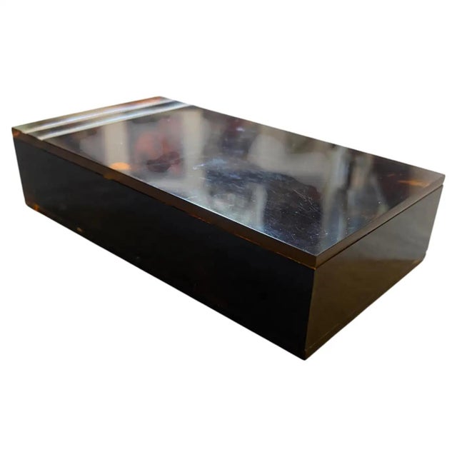 Capturing the opulent essence of 1970s high-society design, this exquisite decorative box is a masterclass in Mid-Century...