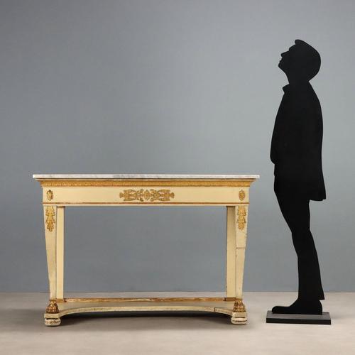 Restoration console table in lacquered and gilded walnut. White marble top supported by curved truncated pyramidal legs...