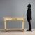 Restoration console table in lacquered and gilded walnut. White marble top supported by curved truncated pyramidal legs...