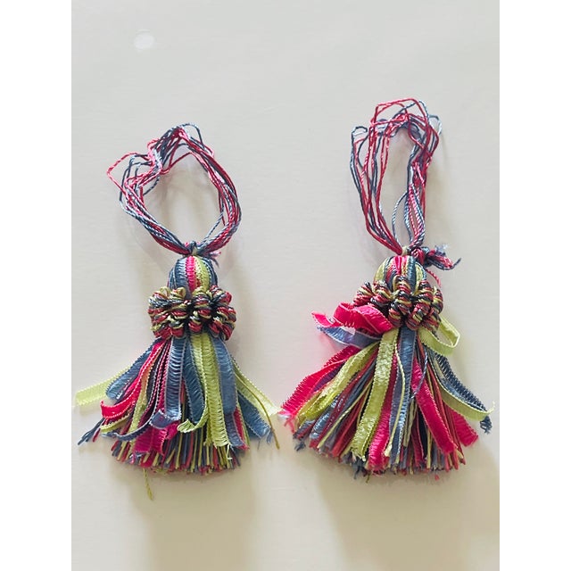 Pair f multicolored key tassels for furniture or doors.