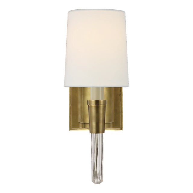 Description: Thomas O'Brien's Vivian creates a chic statement by highlighting the harmonious mix of curved crystal and...