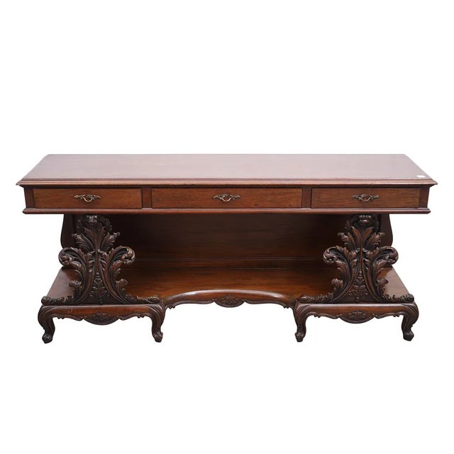 The Low Mahogany Console Table serves as a great TV stand for any traditional style living room. Fully assembled with a...