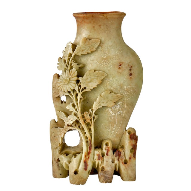 What a unique vase. Hand carved from a single solid piece of jade, this vase is Rare and beautiful. Excellent Condition...