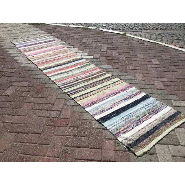 This beautiful, vintage, handwoven kilim rug is approximately 60 years old. It is handmade of hand spun wool and cotton in...
