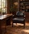 Handsome upholstered armchair combining a rich espresso-brown wood frame with black leather upholstery and bold,...