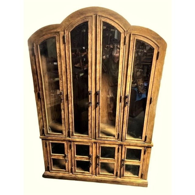 Simple, handsome lines and an arched top combine with solid oak with a distressed fruitwood finish to make this an...