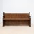 Antique wooden bench dating from the 19th century, with a tall back made of vertical panels. It features two armrests and...