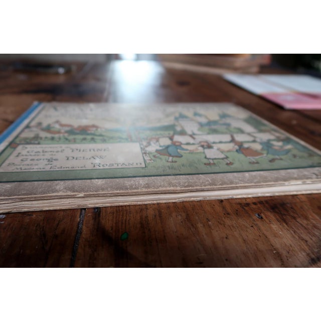 A charming antique French illustrated children's book titled Voyez Comme on Danse: Chansons de Jeu et Rondes Enfantines,...