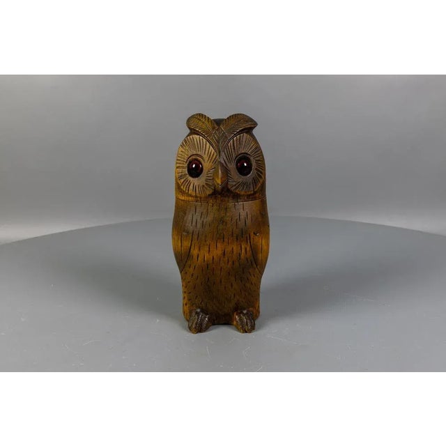 A charming midcentury carved owl-shaped box, crafted in Germany in the 1950s from linden wood in the traditional Black...