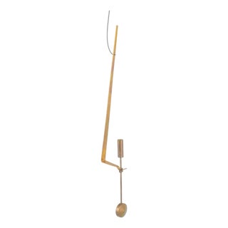 Wall Candleholder in Brass with Pendulum Suspension by Pierre Forsell for Skultuna, 1960s For Sale