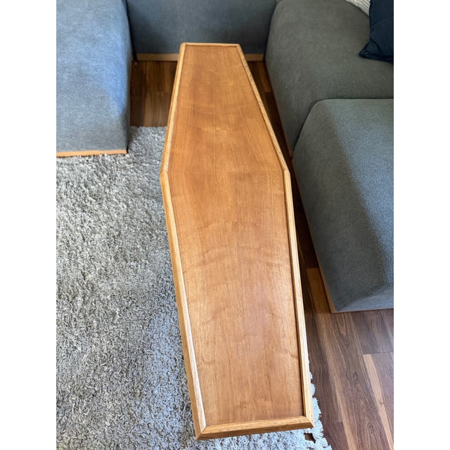 Freshly refinished and exceptionally sculptural, this rare Drexel Heritage coffin-shaped coffee table carries the same...