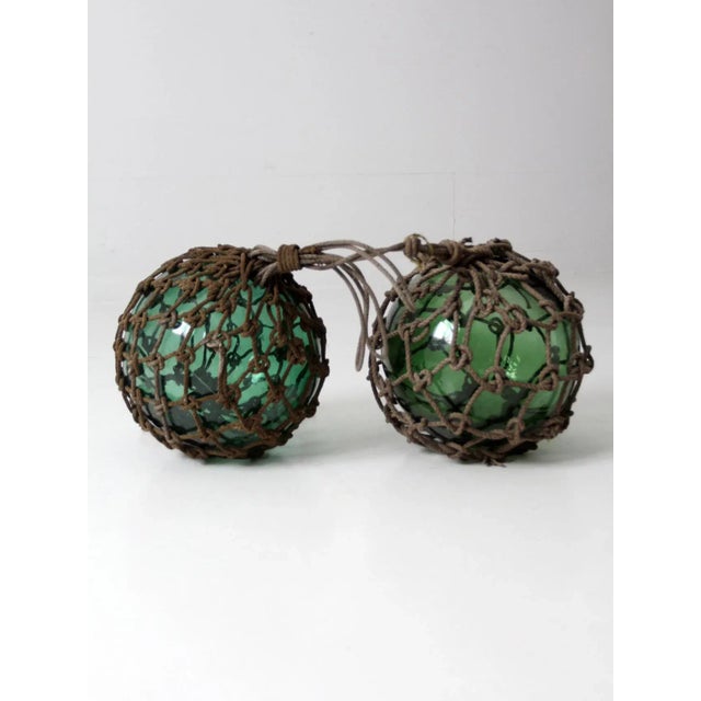 Used by fisherman in the early 20th century these generously proportioned float glass buoys exhibit a fantastic display of...