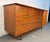 A classic mid-century modern lowboy dresser crafted from richly grained walnut by Young Manufacturing. Features clean...