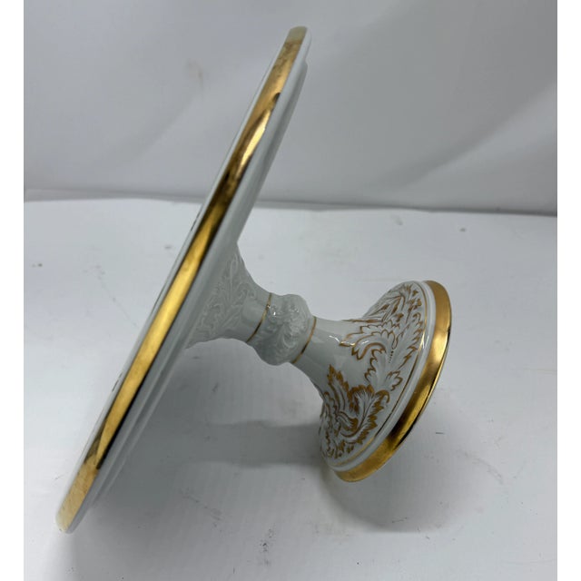 **Royal Porzellan Manufaktur Bavaria Gilded Pedestal Tazza with Scrollwork and Acanthus Leaves** A finely crafted footed...