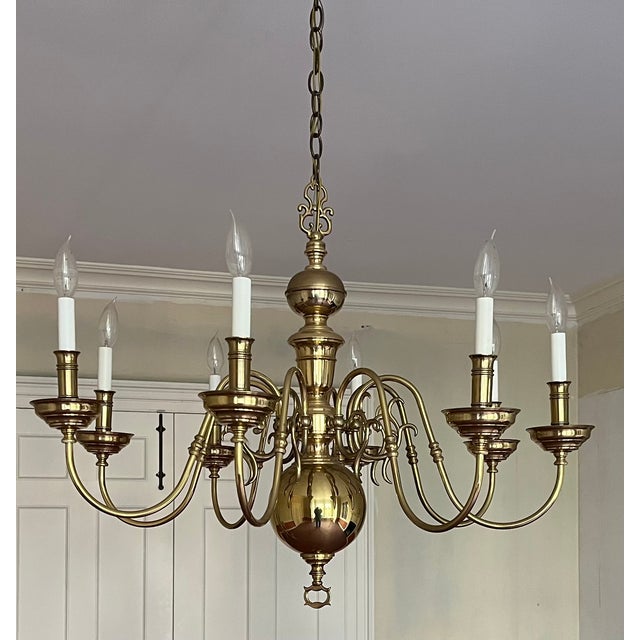 Large eight light brass chandelier in the Dutch Queen Anne style. Graceful proportions - hangs 44" from the ceiling;...