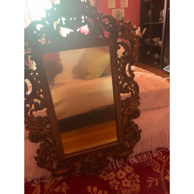 This is a vintage wall mirror from “ Burwood products company” it has an old world look and elegance at the same time,...