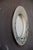 A charming little wall mirror, reminiscent of antique shops and country homes of yesteryear. Its round, matte ceramic...