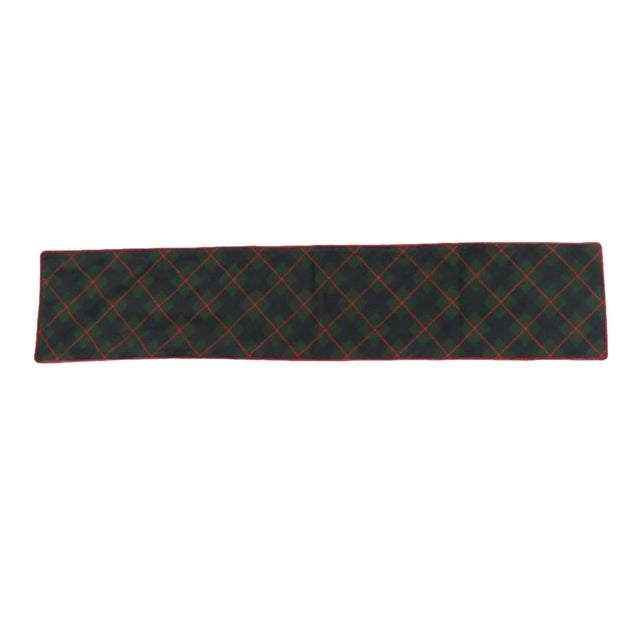 Bring timeless holiday charm to your dining space with this green plaid Christmas table runner, designed to create a warm...