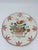 This is a hand-painted earthenware plate with a charming folk-art floral and bird motif, likely intended as a decorative...