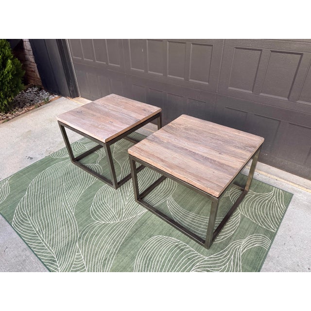 Beautiful pair of authentic Mitchell Gold + Bob Williams side/end tables featuring thick rustic wood tops paired with...