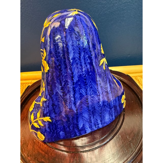 Beautiful vintage Madonna made of porcelain with cobalt blue and yellow glazing. Her face is so pretty and humbling.