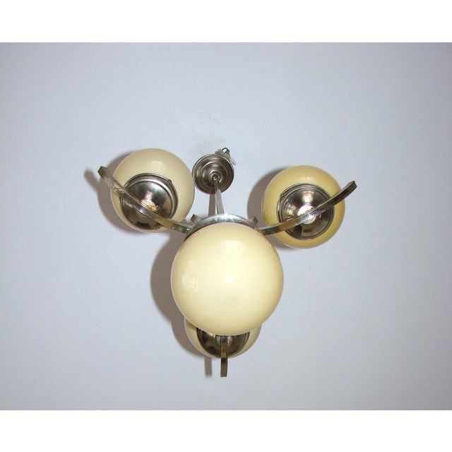 Art Deco Chandelier, 1920s, in Good conditions. Designed 1920 to 1949 Up to 250V (Europe/UK Standard).The wiring of this...