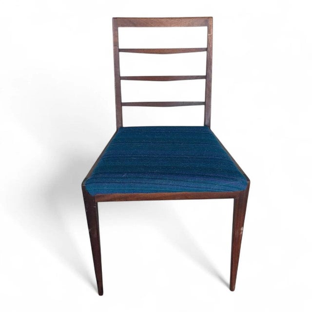This mid century dining chair by McIntosh combines timeless style and durable construction to enhance your dining space...