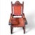 This striking Spanish Colonial-style silla amplia chair captures timeless elegance and craftsmanship. The chair features a...