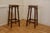 A Pair of French walnut farmhouse high kitchen stools These are an elegant pair they have a square seat and are set on...