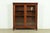A beautiful antique American Empire or Victorian glass front double bookcase cabinet In the manner of R.J. Horner & Co....