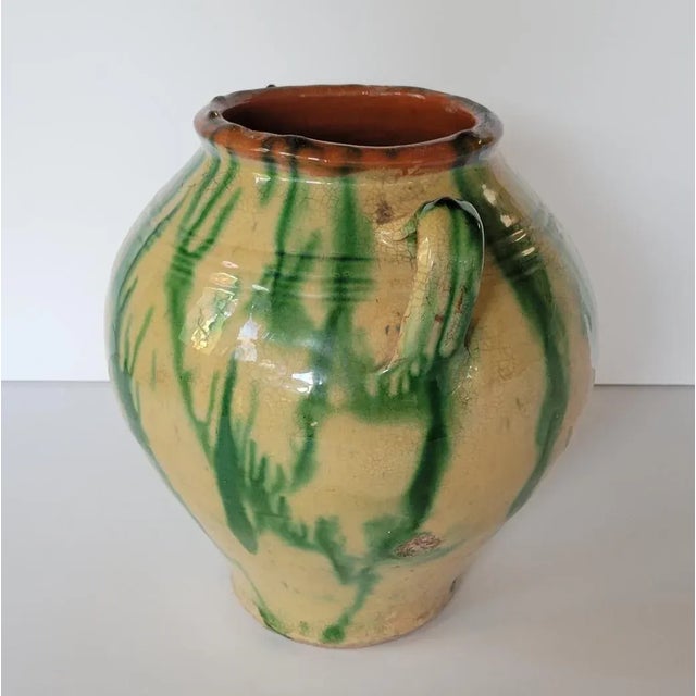 Very collectible Country French yellow and green glazed terra cotta pot with 2 ear handles. From the Southwest of France,...