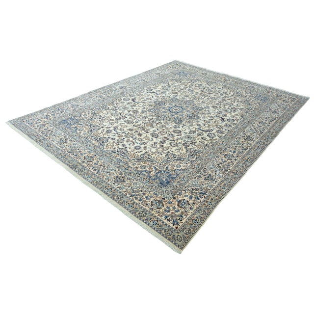 This exclusive hand-knotted Nain 9 La oriental rug with generous dimensions of 403 x 303 cm impresses with its exceptional...