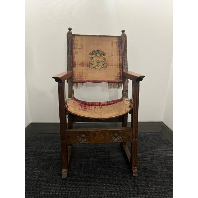 This rare pair of antique circa 1500 Spanish velvet side chairs with family crest was purchased from L'Antiquaire and the...