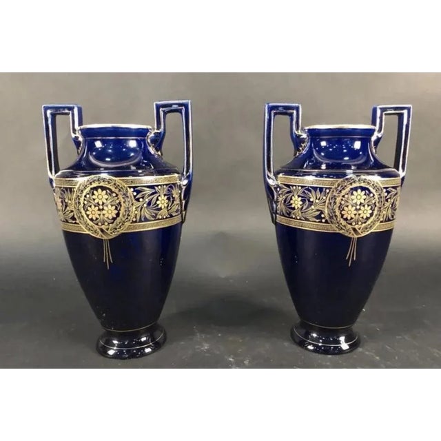 Vase (x2) amphora Boch brother Keramis 1890 It is a pair of spindle vases in royal blue enameled earthenware (known as...