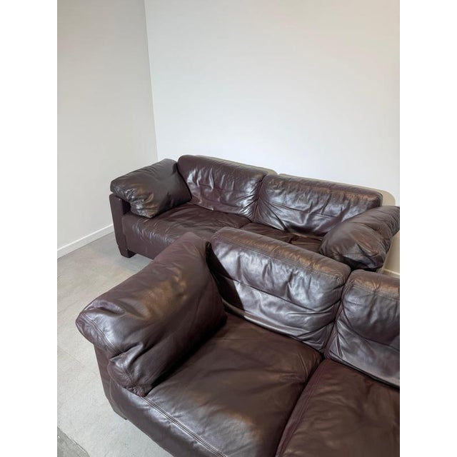 This iconic Swiss design combines deep comfort with timeless brutalist-inspired lines and beautifully aged leather patina....