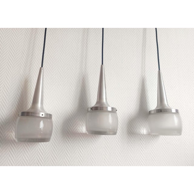 Set of three P1116 pendant lights by Staff Leuchten, a space-age style piece dating from around 1970. Each pendant...