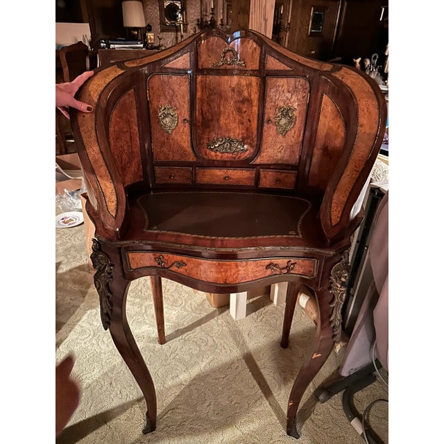 Antique French-Style Writing Desk with Ornate Carvings & Inlaid Wood Elevate your space with this exquisite antique...