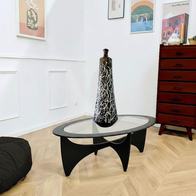 Tall ceramic mid century modern vase, Italy circa 1960s. The mid century tall vase is black with a bronze effect and has...