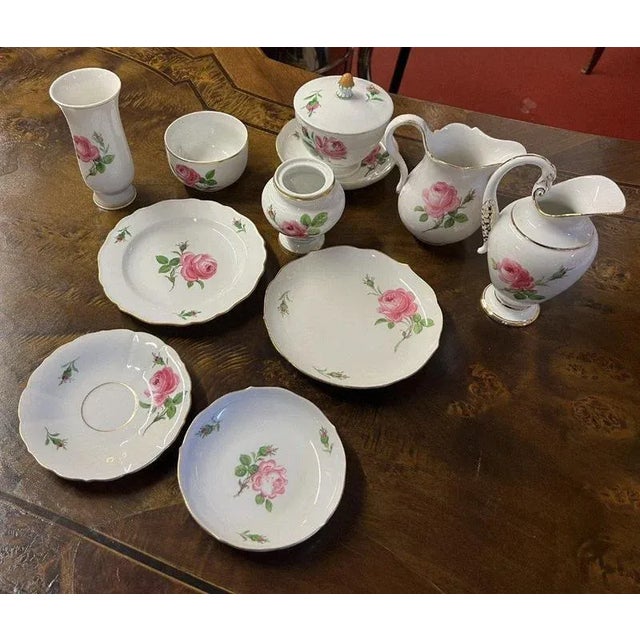Meissen: set of 11 porcelain rose pattern pieces circa 1930 marked under the heel Dimensions: max. height 17cm This piece...