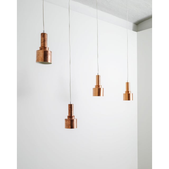 A rare set of four decorative swedish mid century copper ceiling pendants model "t-292" designed by hans-agne jakobsson...