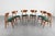 Set of six solid wood chairs with green fabric-upholstered seats. Scandinavian production from the 1960s. Wear consistent...
