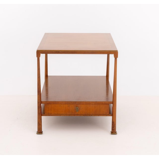 Mid-Century Modern Teak Two-Tier End Table, the square top with single drawer above four brass feet, "JS Inc. / Designer /...