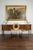 A French vintage giltwood sunburst mirror from the mid-20th century, with rays of slightly varying sizes, carved frame and...
