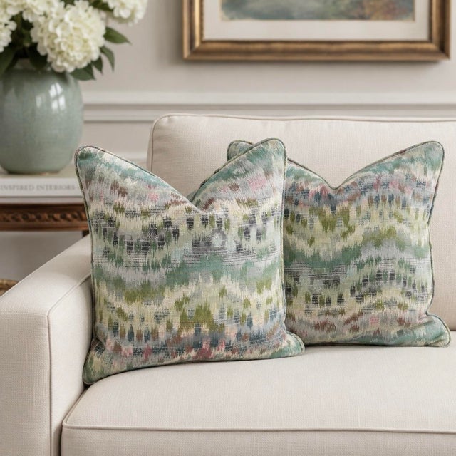 These custom decorative pillows are handcrafted from Robert Allen “Distant Dawn” woven fabric in the Viridian colorway,...