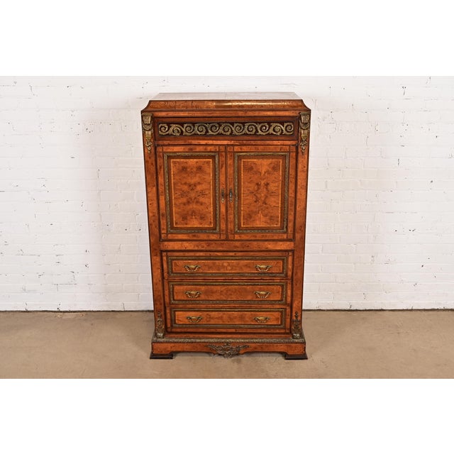 A beautiful antique French Empire armoire dresser or gentleman's chest In the manner of Maison Forest France, Circa 1880s...