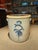 This antique salt-glazed stoneware crock showcases a cobalt blue hand-painted design, often called a "bee sting" pattern....