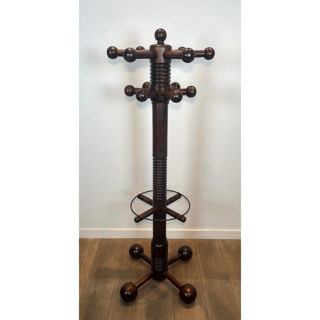 This beautiful, decorative, brutalist coat rack is made entirely of carved oak. It is a French work by the famous designer...
