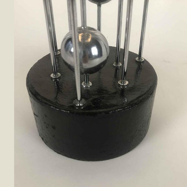 Banci Table Lamp, circa 1980. Chromed steel lamp with spheres of various diameters attached to uprights that, from a...